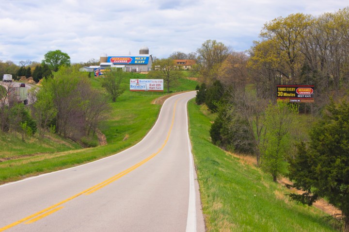 Hoardings and a barn roof advertising Meramec Caverns in Stanton, Missouri, The caverns were a tourist attraction for travelers on the original Route 66 through the Ozarks in Missouri and the historic signs have become an attraction in themselves