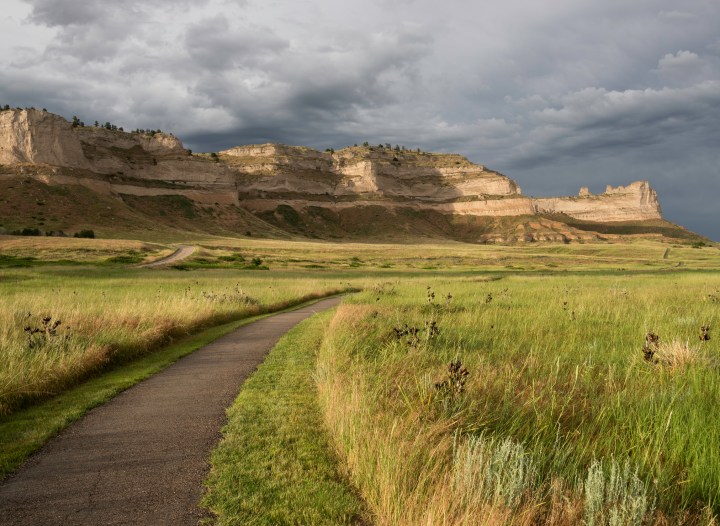 Scotts Bluff National Monument is located in western Nebraska. An early summer thunderstorm brings rain to the prairie surrounding Scotts Bluff National Monument.
