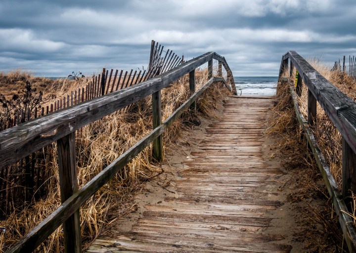 an old wooden pathway to the beach