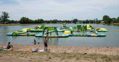 The Most Epic Resort Campground In Iowa Is An Outdoor Playground With A Water Obstacle Course, River Tubing, And More
