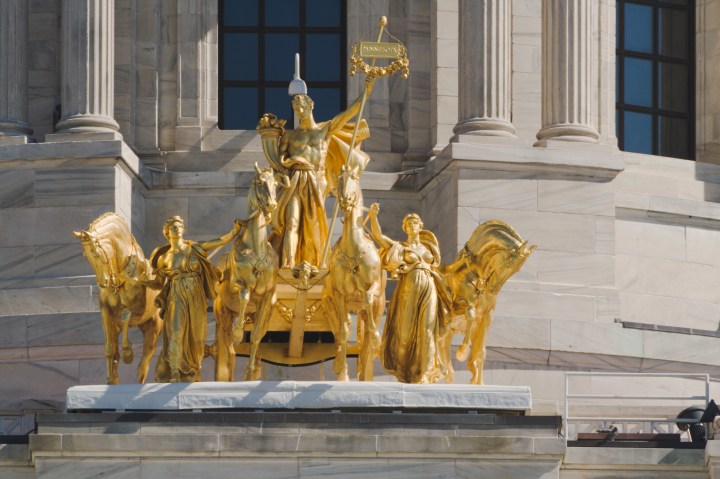 Subject: The 1906 historic golden four horses chariot sculpture Quadriga of the State capitol building of the state of Minnesota.