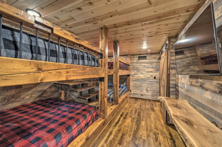 In another main floor room, you'll find another spacious room with four Queen-size bunks — great for an adult sleepover, or plenty of room for the kiddos.