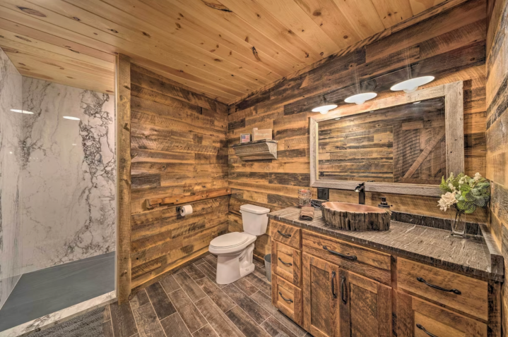 Each bathroom features beautifully carved sink bowls, as well as spa-like standing showers. The upper bathroom is en suite to a bedroom, which offers another King-sized bed. A washer and dryer is also on site for a convenient like-home experience.