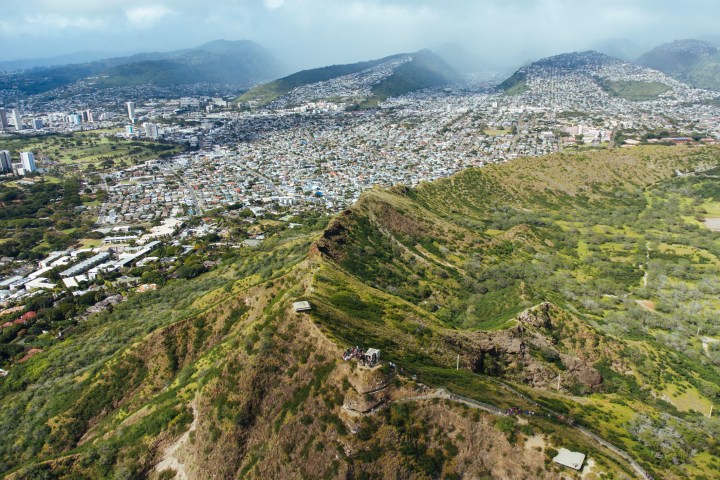 The crater of Diamond Head, surrounded by the Honolulu's residential district.