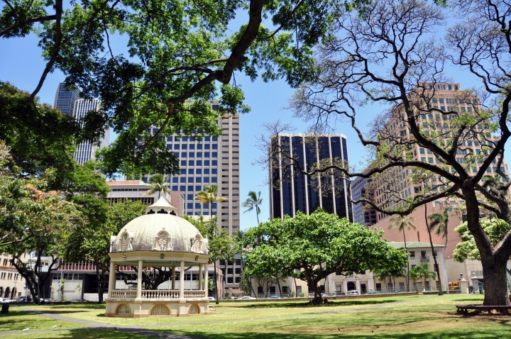 Royal Bandstand on the grounds of the Iolani Palace for the kings of Hawaii in the ninteenth century. Honolulu skyline in the background.
