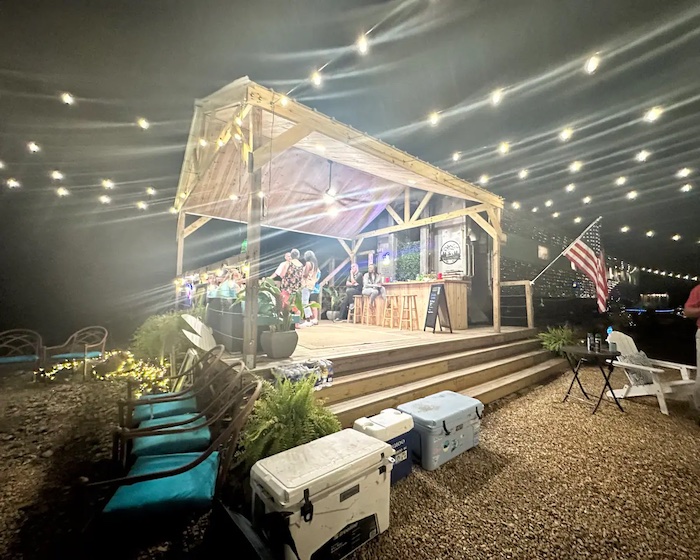 Cookout pavilion for socializing and karaoke adjacent to an Airbnb vintage train car near Birmingham, Alabama.